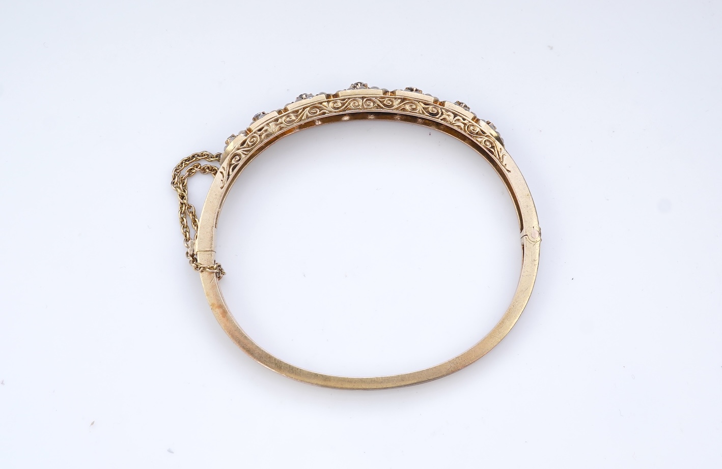An Edwardian seed pearl and diamond bangle, early 20th century